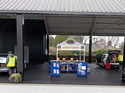 The Liskeard Lions stand and people donating